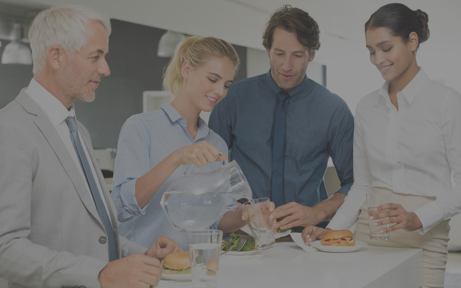 young businesswoman pouring water